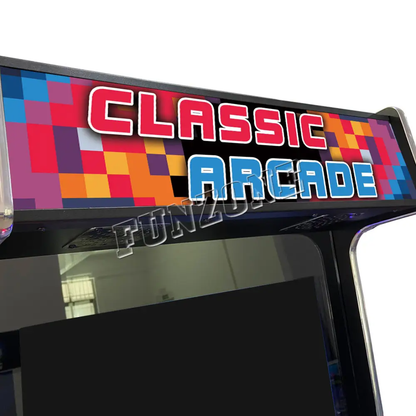 Close up view of arcade machines marquee which features a multicolor pixel design of yellow, orange, blue and purple. The marquee in orange and blue text says classic arcade.