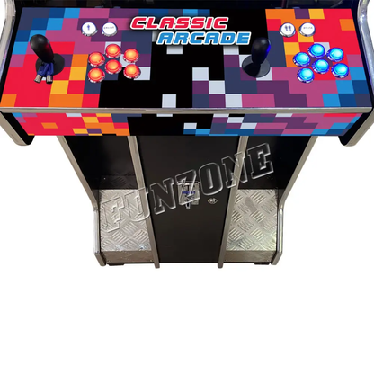 Close up Ariel view of arcade control panel that features a multicolor pixel design, 2 black joysticks, 6 red buttons, 6 blue buttons, and 4 white buttons. The control panel also says Classic Arcade in orange and blue text which is located on the top center of the panel. 